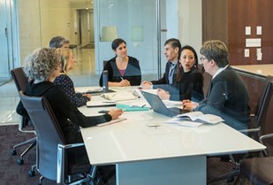 A group of people sitting around a table